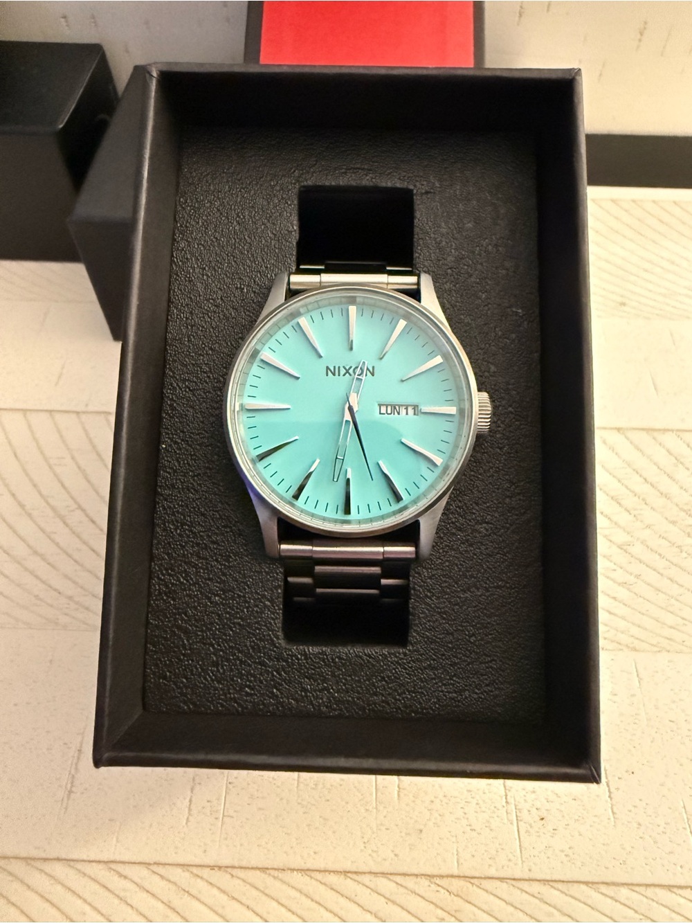 Nixon Sentry SS Men’s Watch with Turquoise Dial and Silver Bracelet